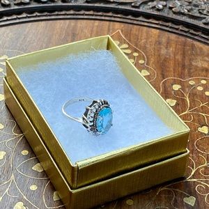 Silver ring with blue topaz stone, size 7
